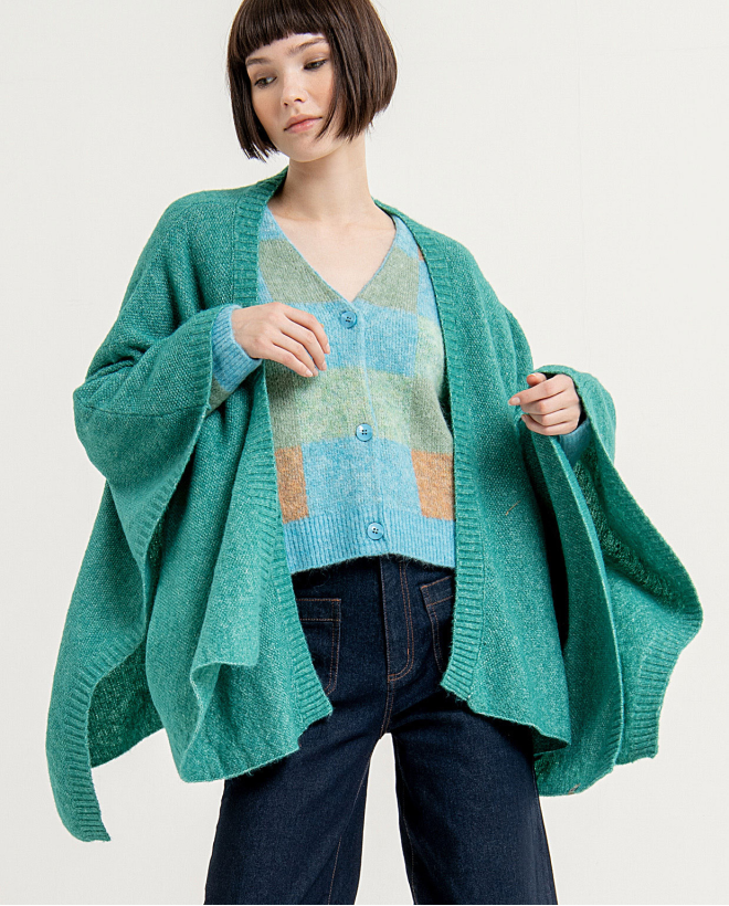 Open short poncho in plain knitted rice fabric Blue