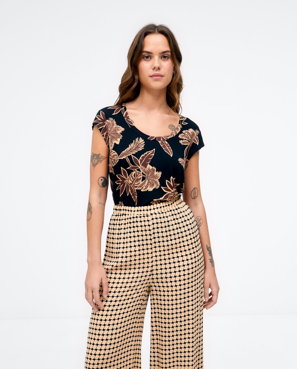 Long and wide trousers.  Beige