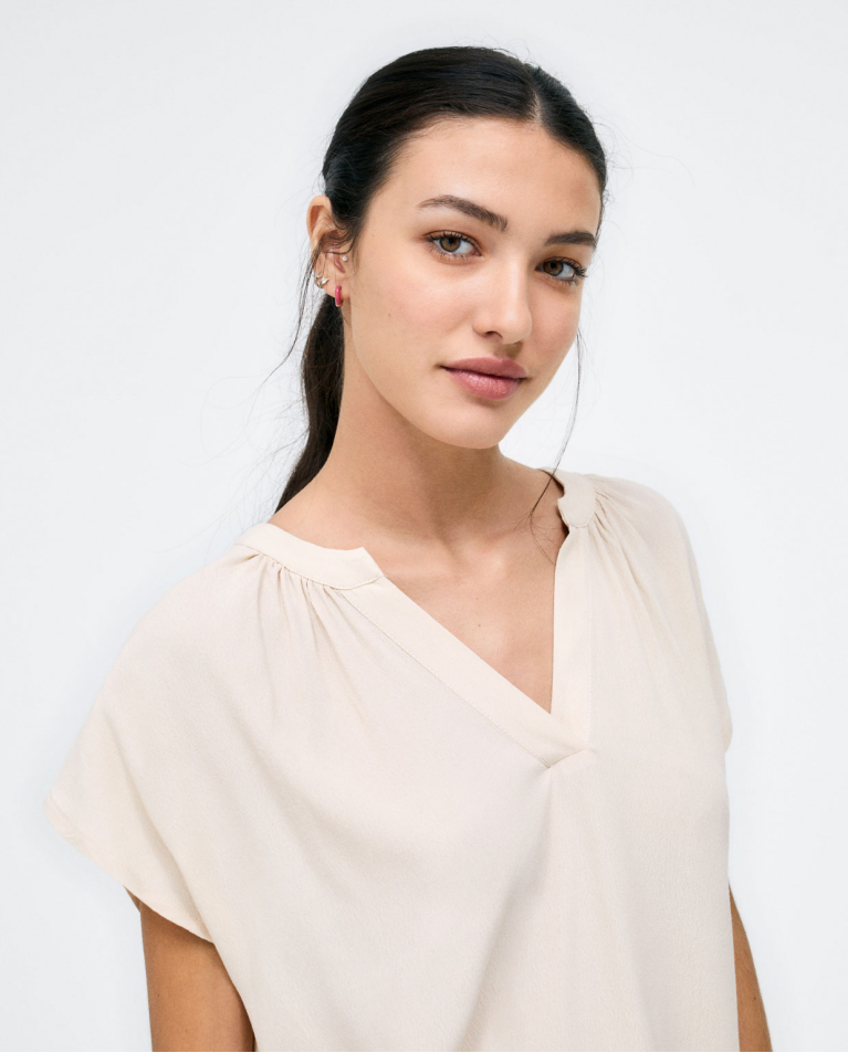 Short sleeve V-neck blouse. Beige