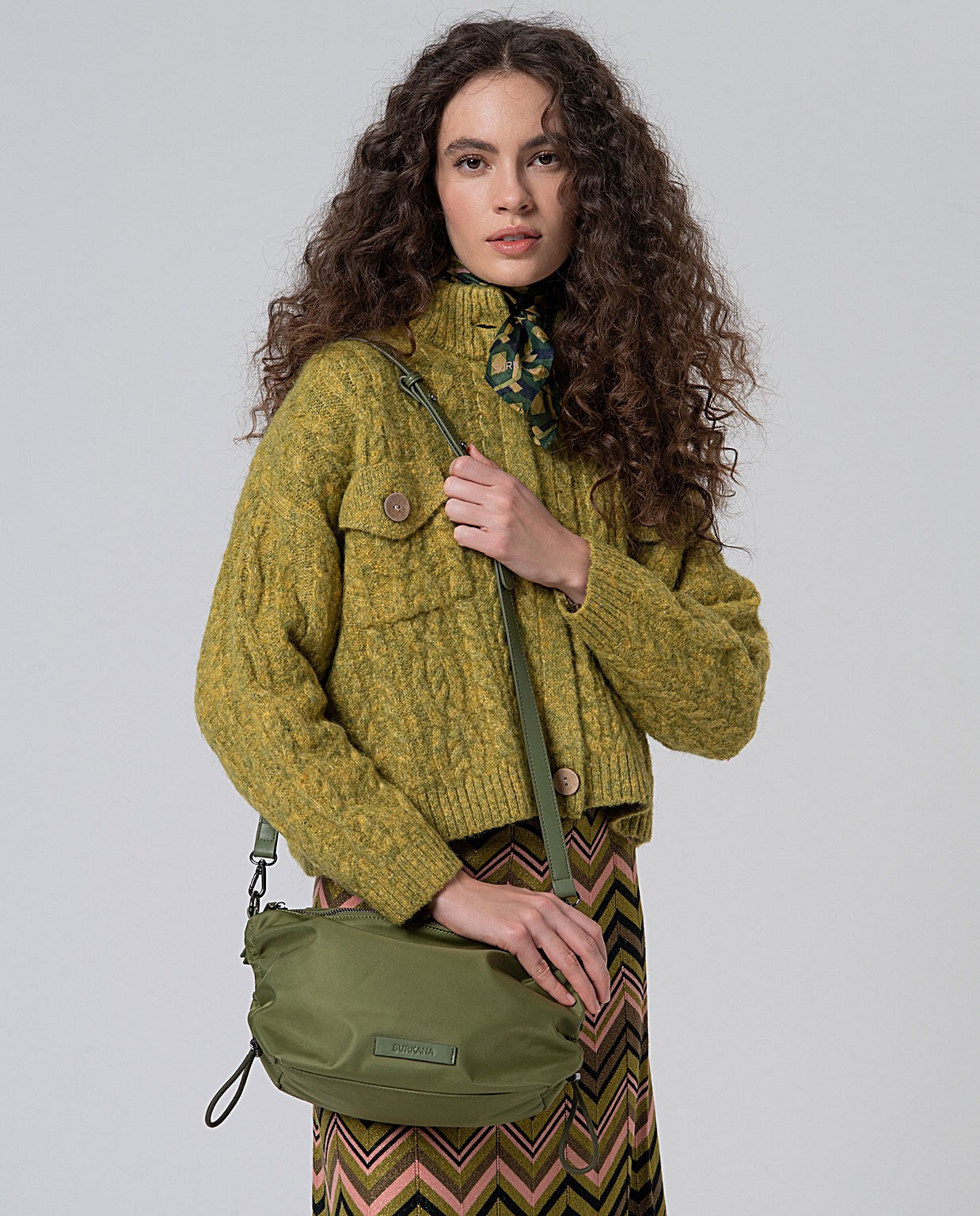 Nylon messenger bag with ruffled design Green