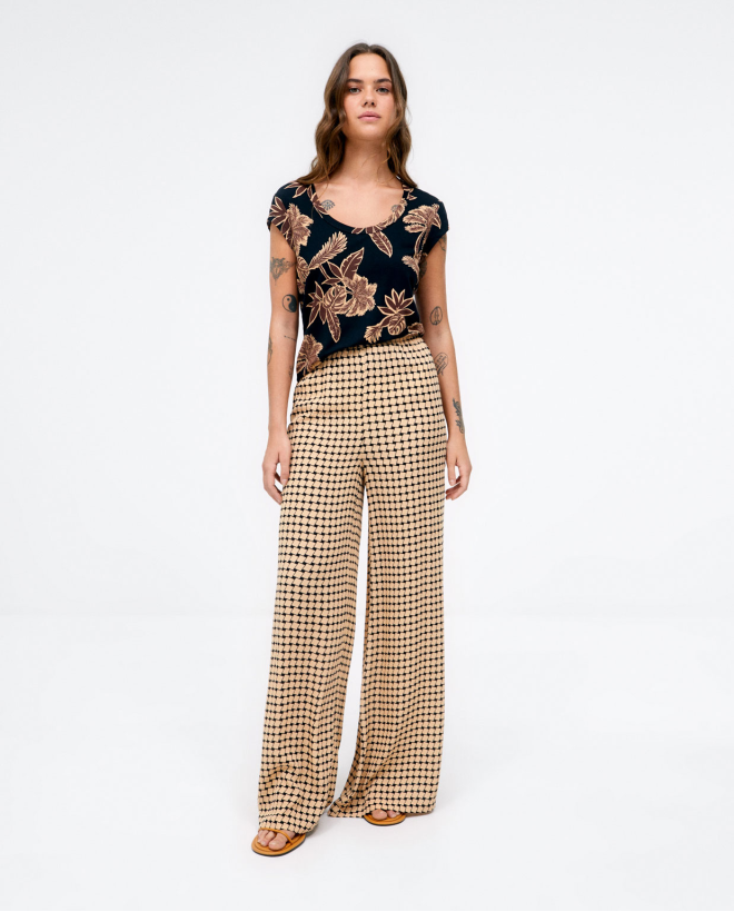 Long and wide trousers.  Beige